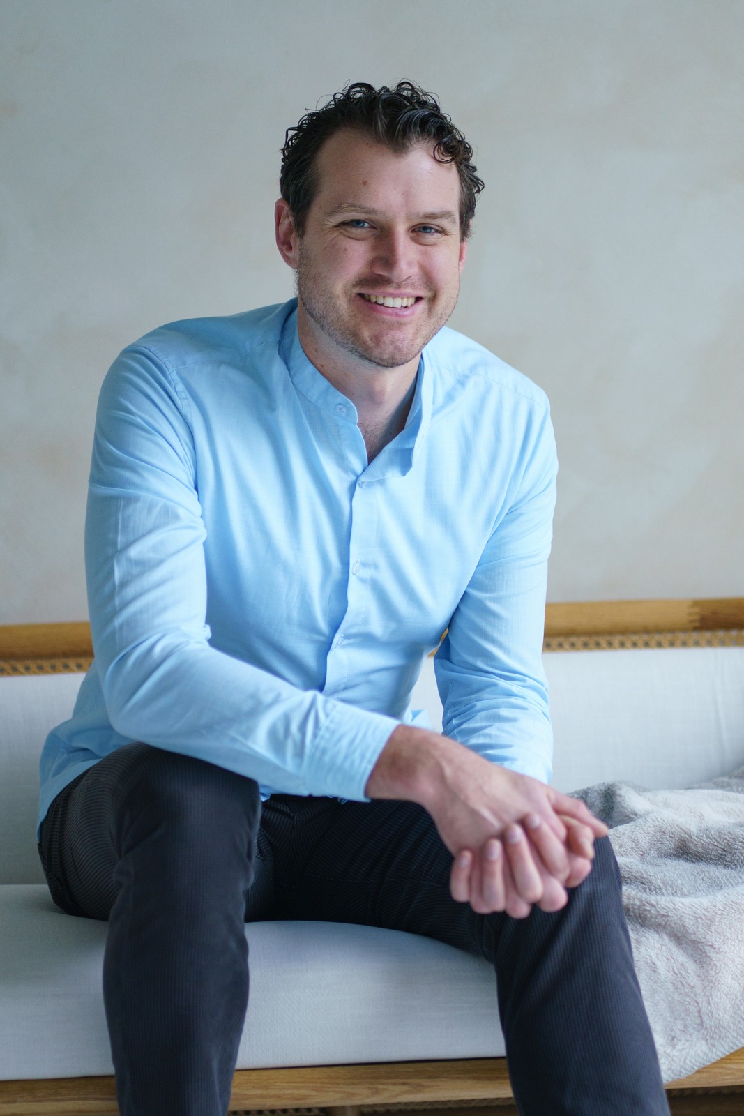 Robert Kuncewicz smiling in a light blue shirt